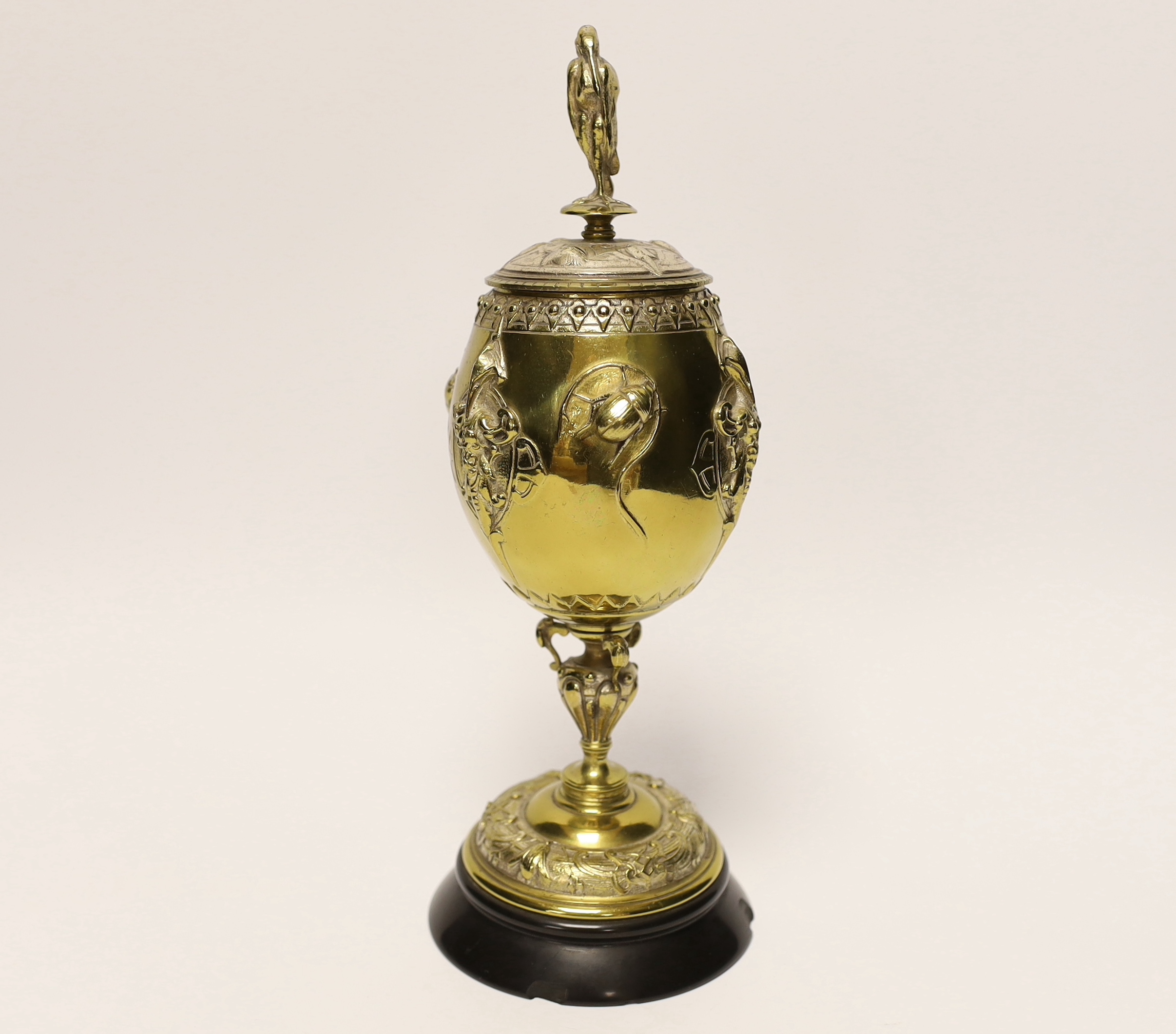 A brass and plated goblet and cover raised on circular slate base, body signed A Cain, 25cm high